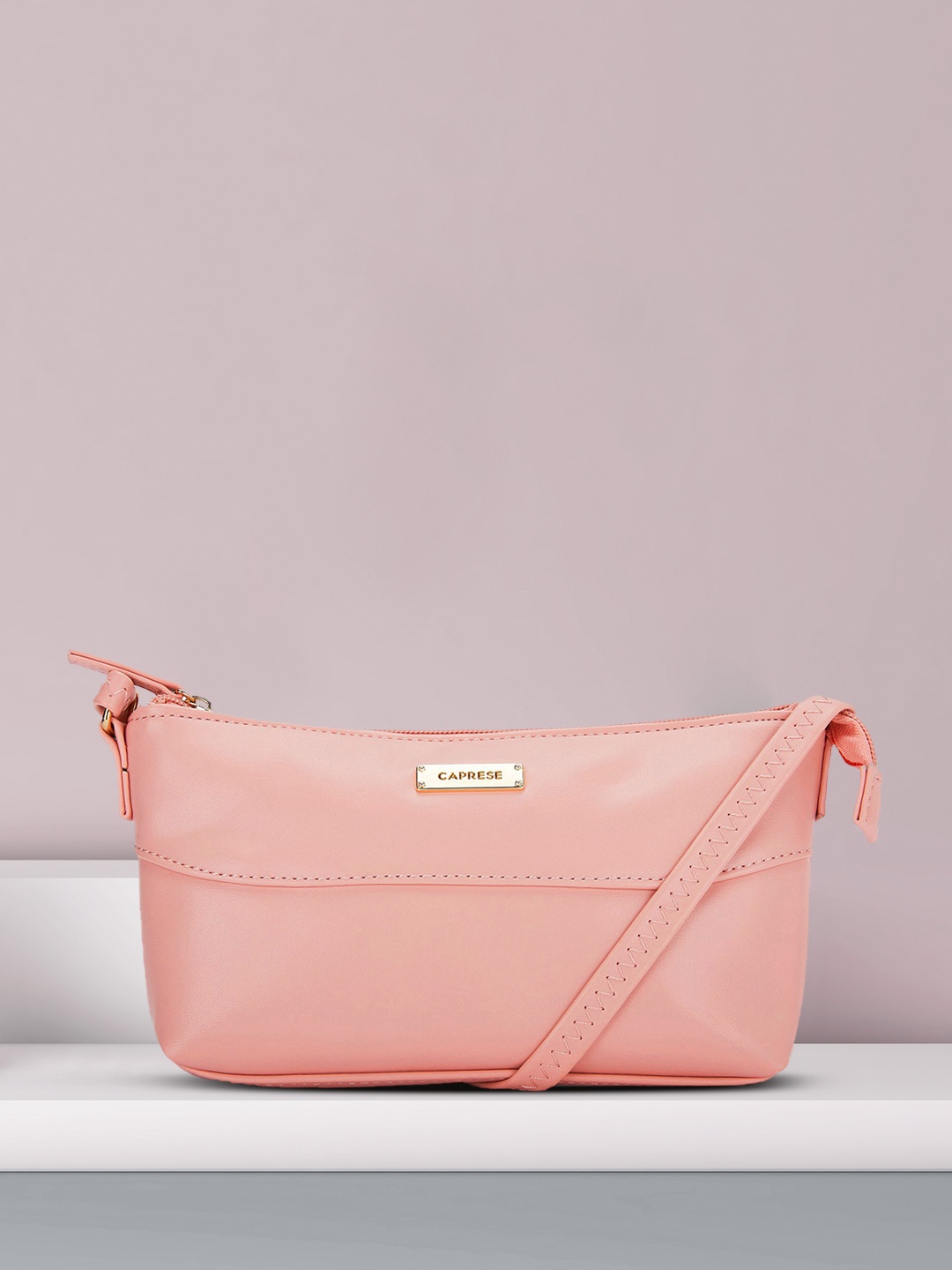 

Caprese Pink Solid Structured Sling Bag