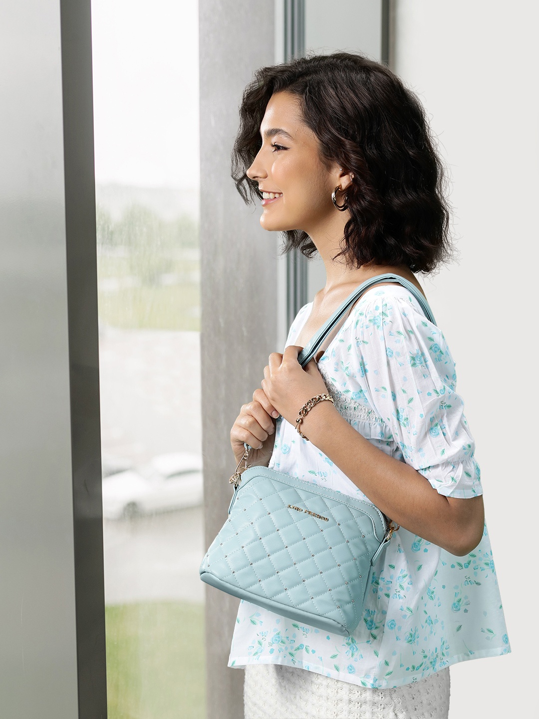 

Lino Perros Women Blue Quilted Sling Bag