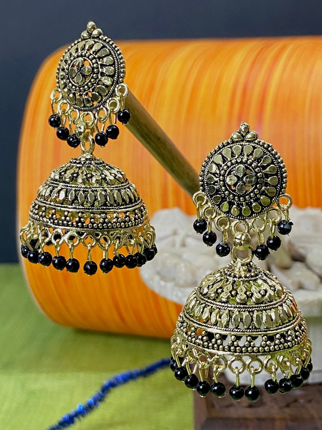 

ANIKAS CREATION Black & Antique Gold-Toned Dome Shaped Jhumkas