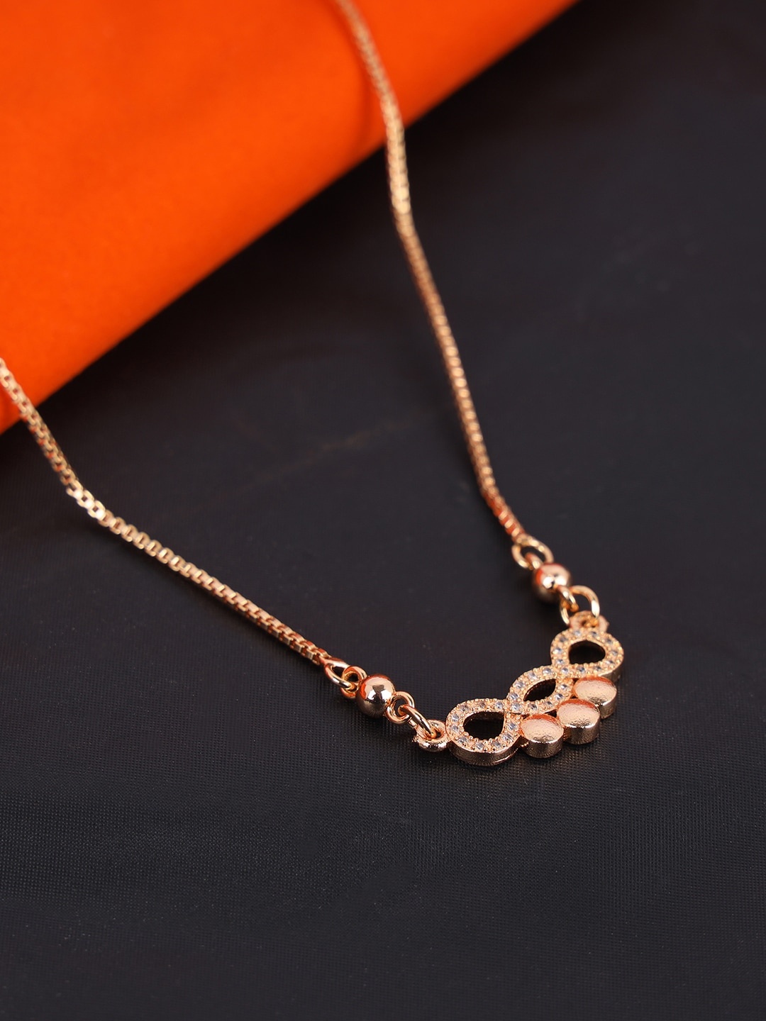 

ANIKAS CREATION Gold-Plated White AD-Studded Mangalsutra