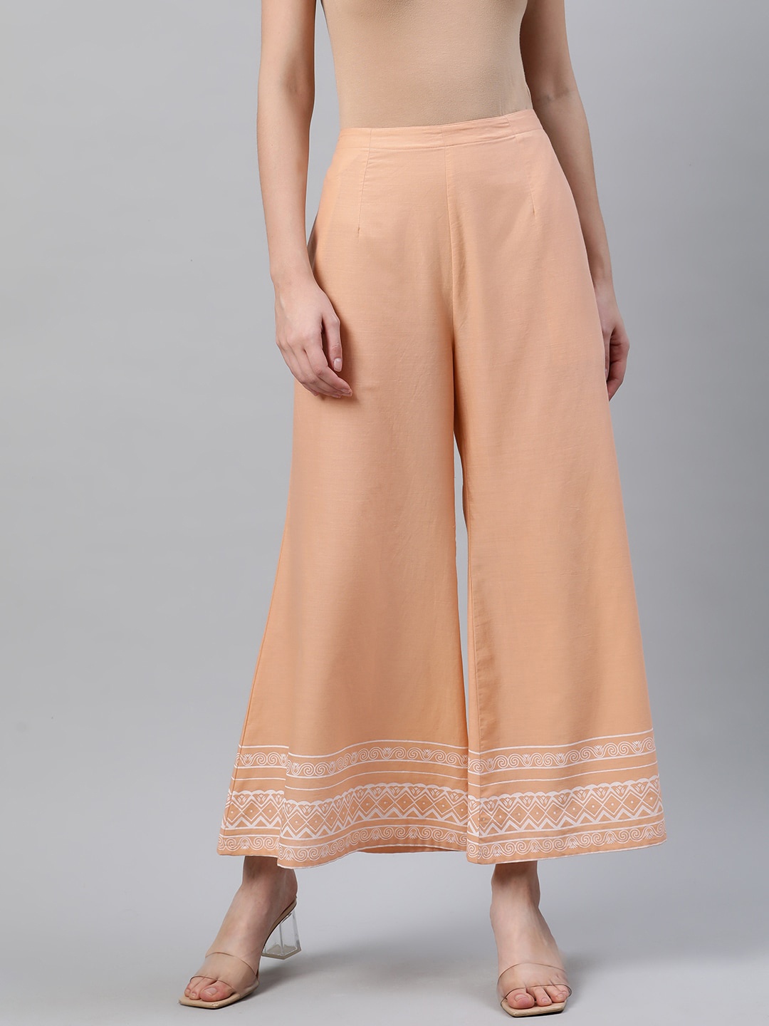 

Libas Women Peach-Coloured & White Hem Design Wide Leg Palazzos