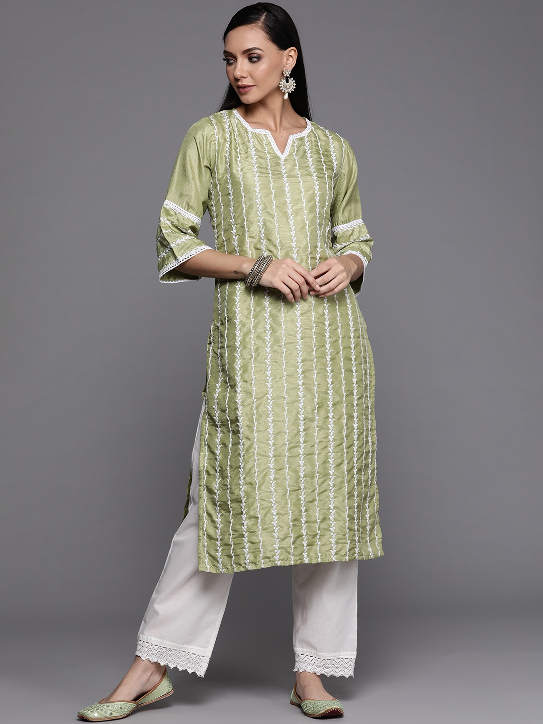 

Libas Women Green & White Ethnic Motifs Embroidered Thread Work Kurta