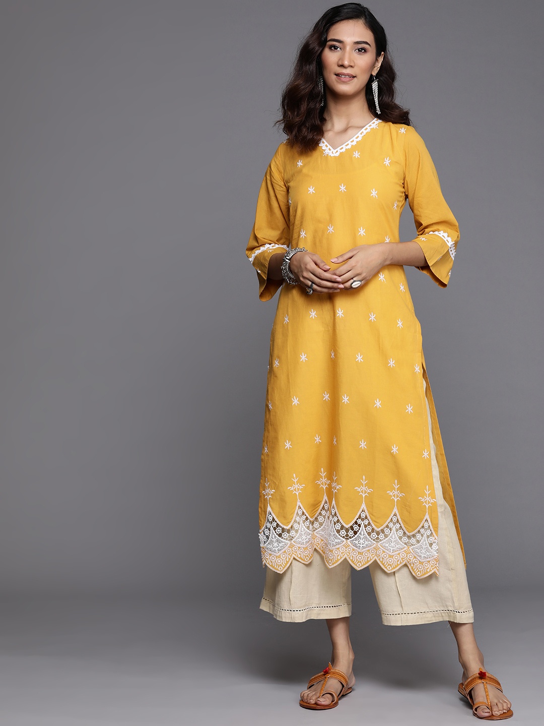 

Libas Women Yellow & White Ethnic Motifs Embroidered Pure Cotton Kurta