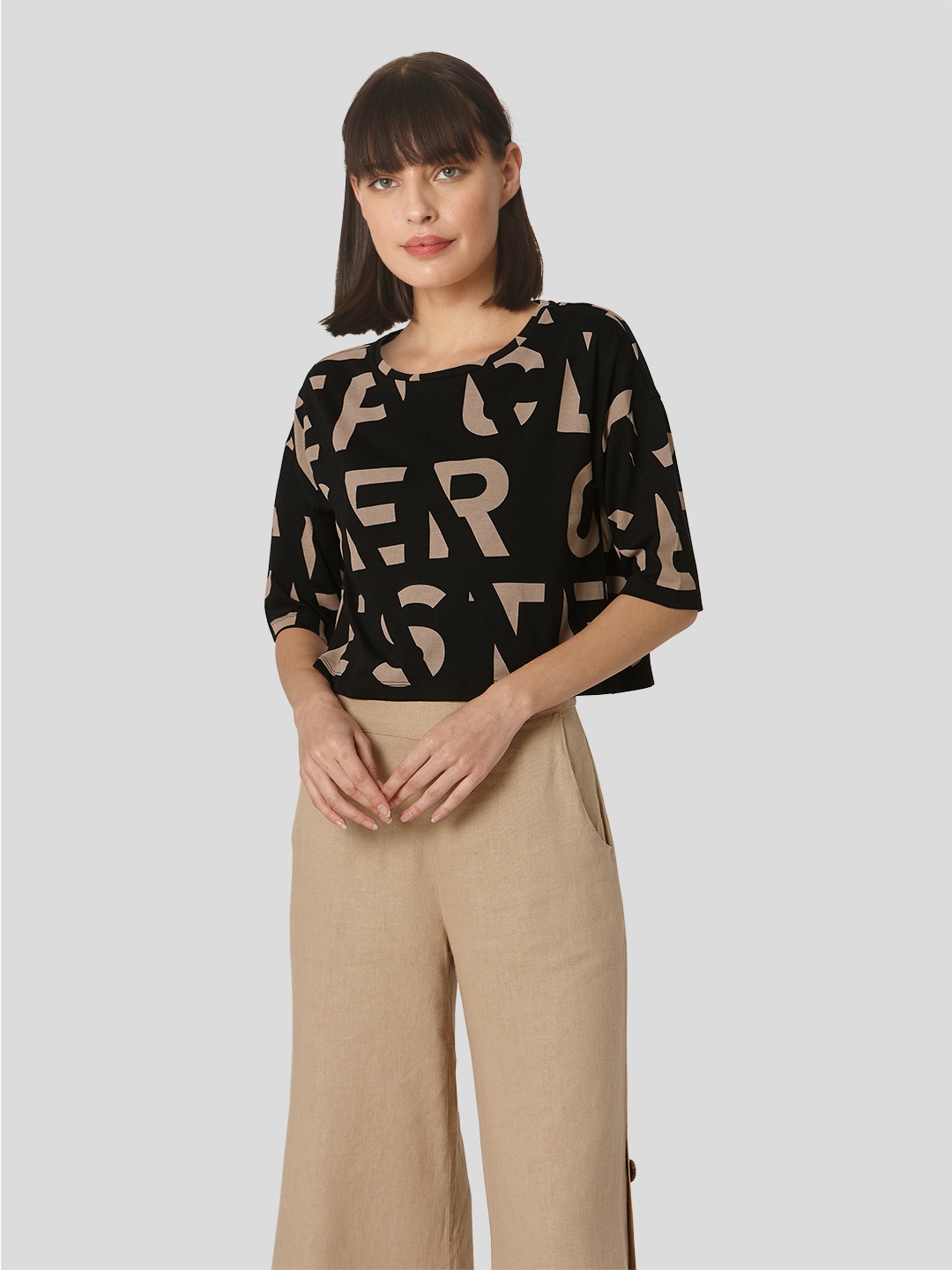 

Vero Moda Women Black & Beige Typography Printed Drop-Shoulder Sleeves T-shirt