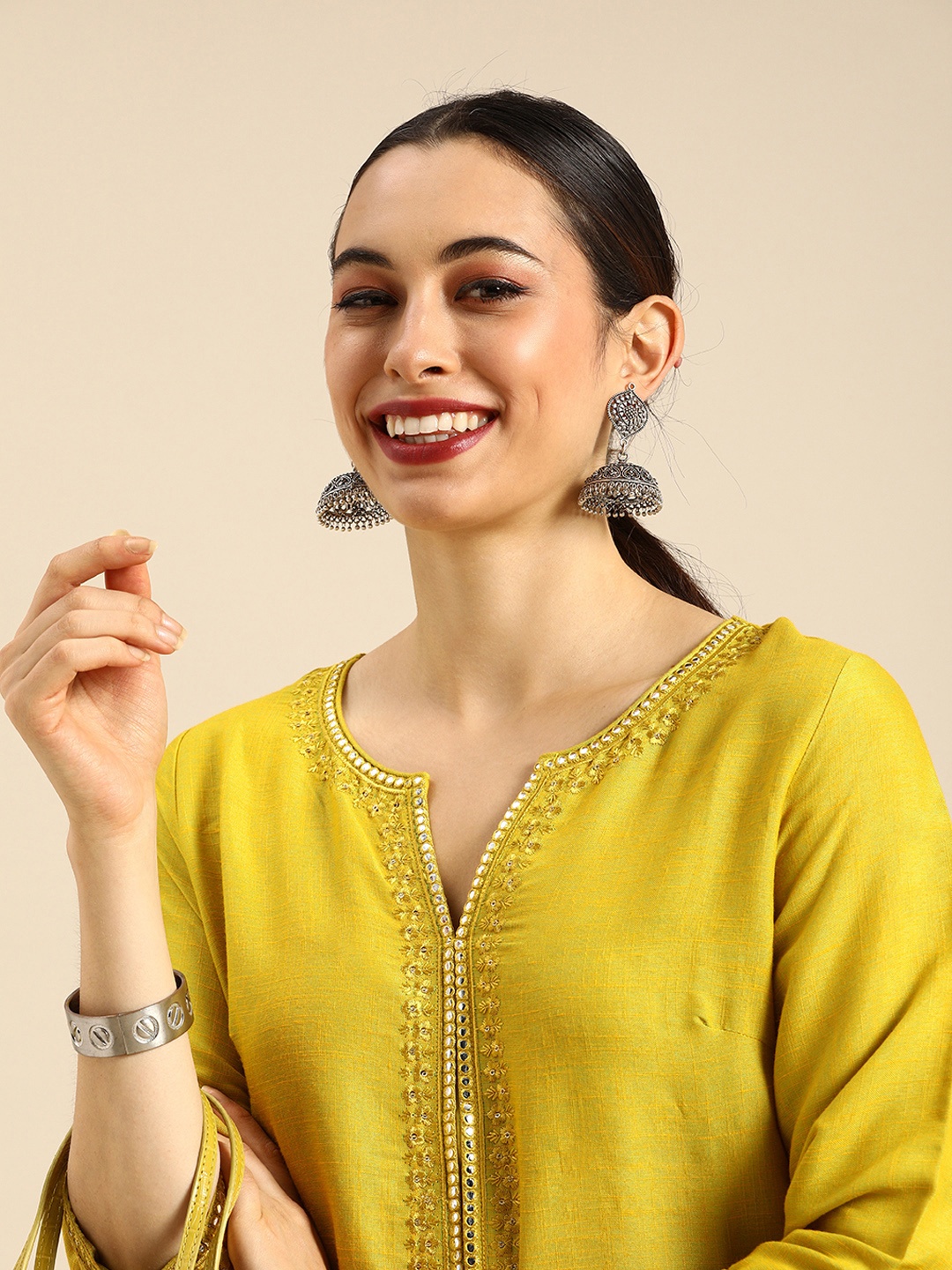 

Anouk Women Yellow Floral Embroidered Regular Mirror Work Kurta with Trousers