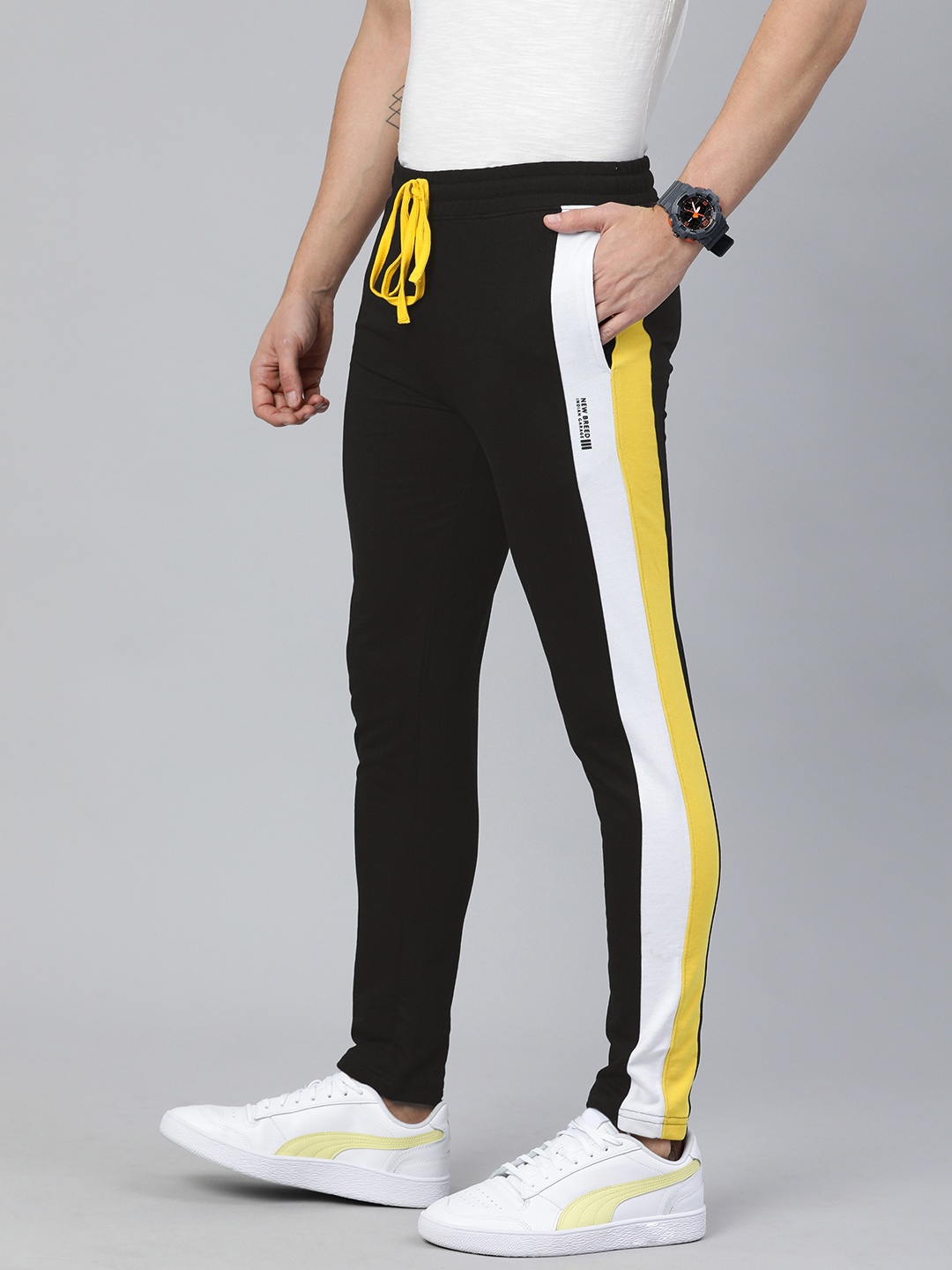 

The Indian Garage Co Men Charcoal Grey Solid Regular Fit Track Pants with Side Stripes, Black