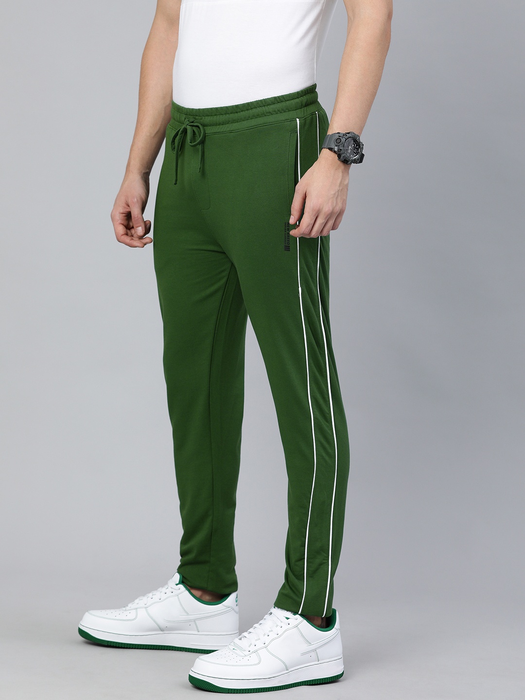 

The Indian Garage Co Men Men Green Solid Slim-Fit Track pants With Side Piping