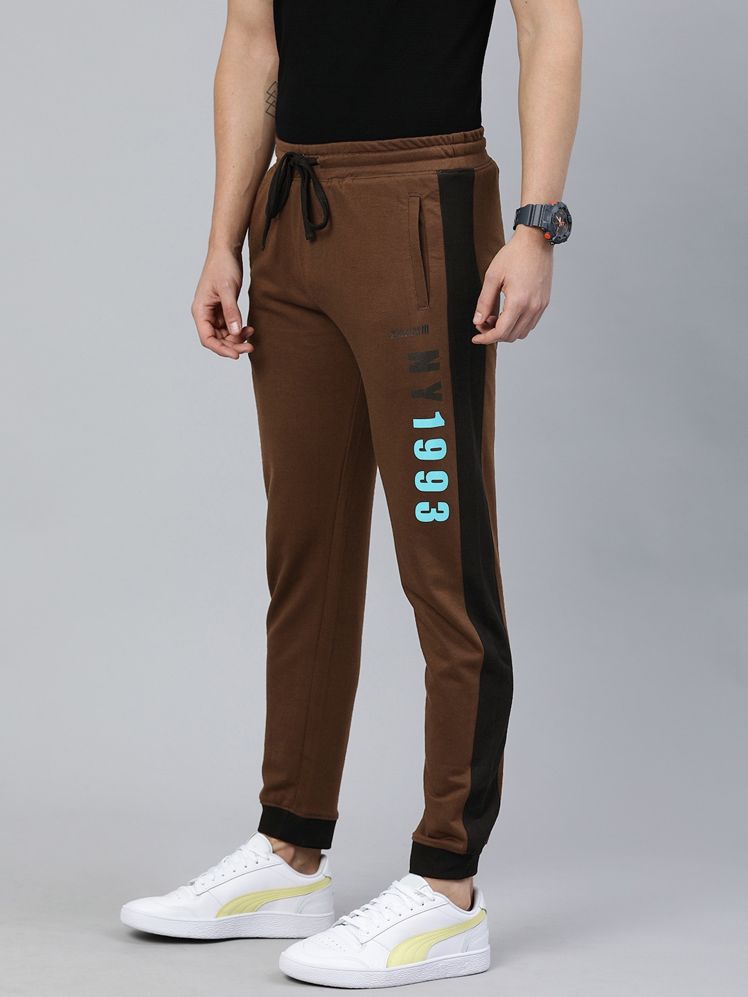 

The Indian Garage Co Men Brown Solid Regular Fit Joggers with Print Detail