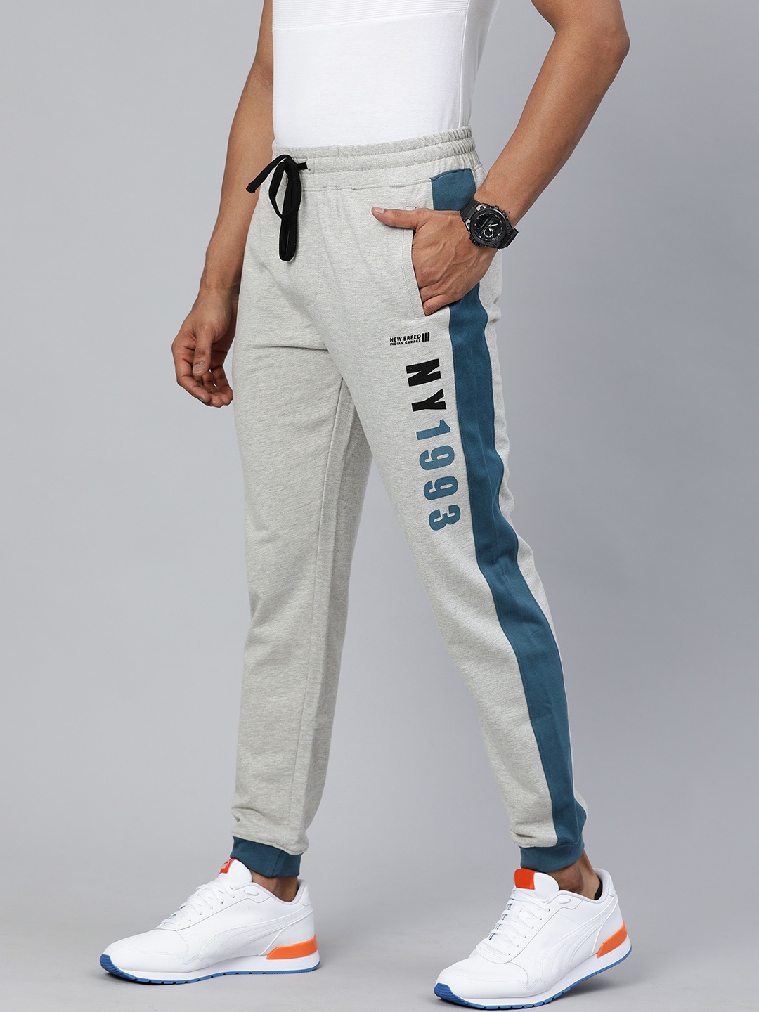 

The Indian Garage Co Men Grey Solid Regular Fit Joggers with Print Detail