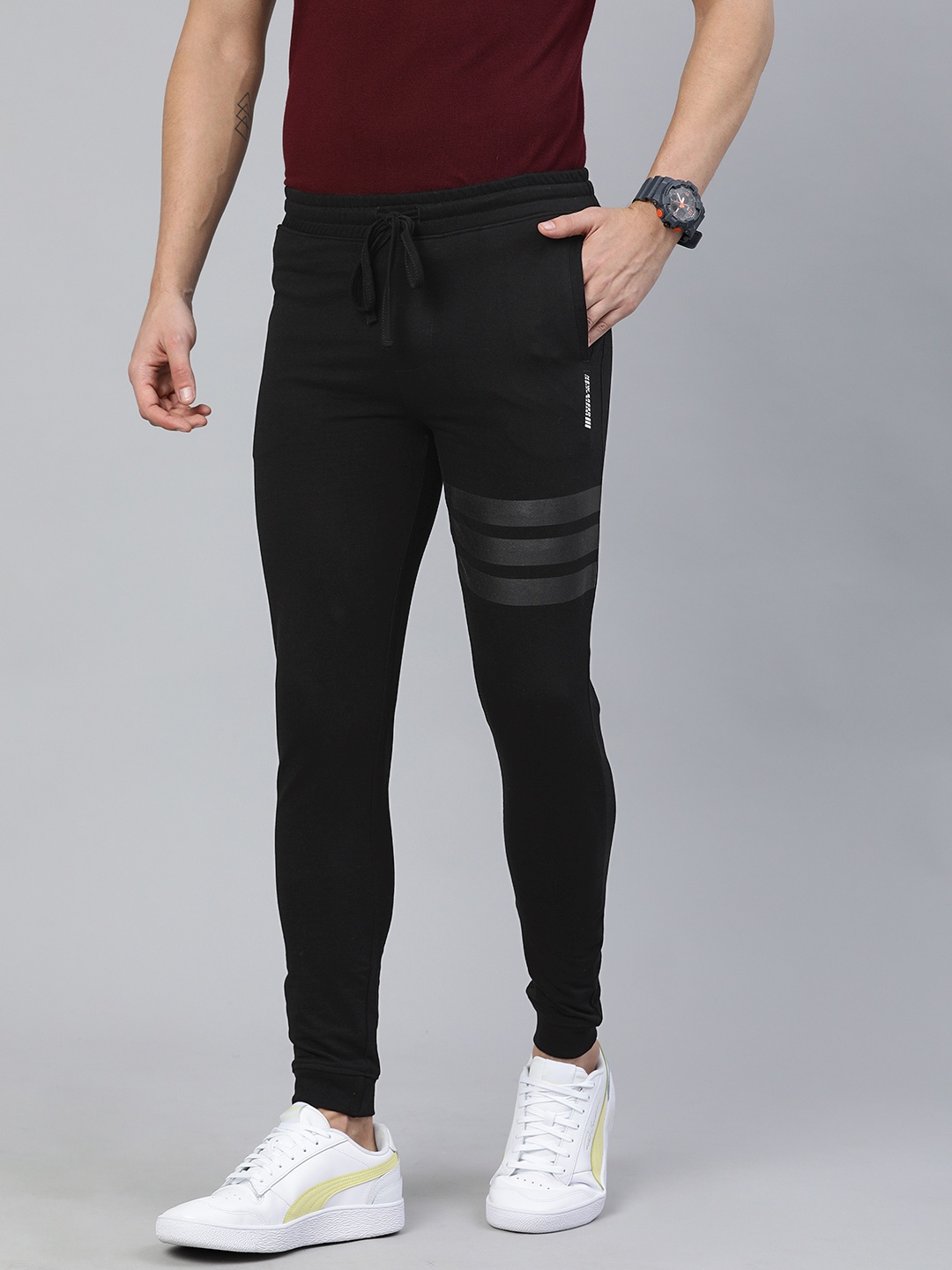 

The Indian Garage Co Men Black Solid Regular Fit Joggers with Stripe Detail