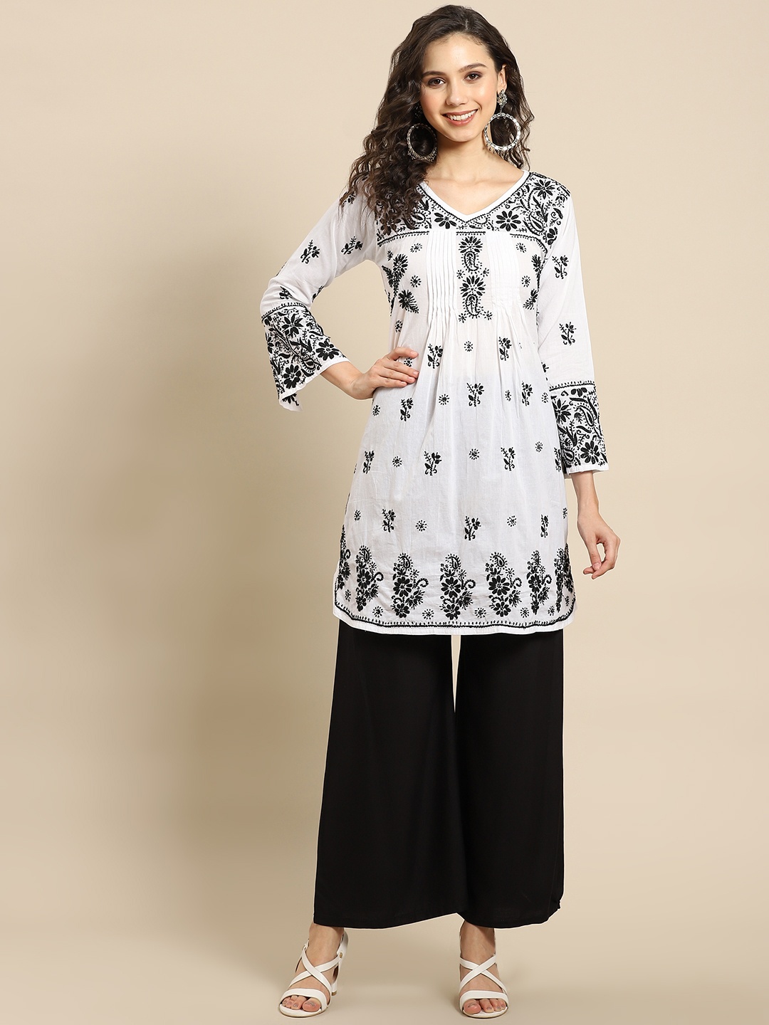 

Saadgi Women White & Black Motifs Cotton Chikankari Panelled A-line Kurta with Palazzos