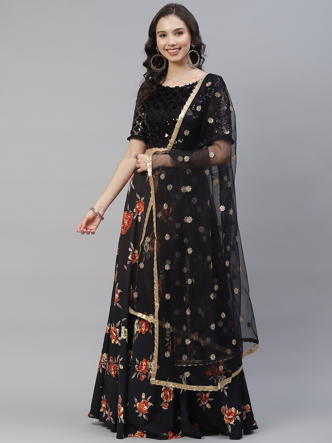 

SHUBHKALA Black & Orange Embellished Foil Print Semi-Stitched Lehenga & Unstitched Blouse With Dupatta