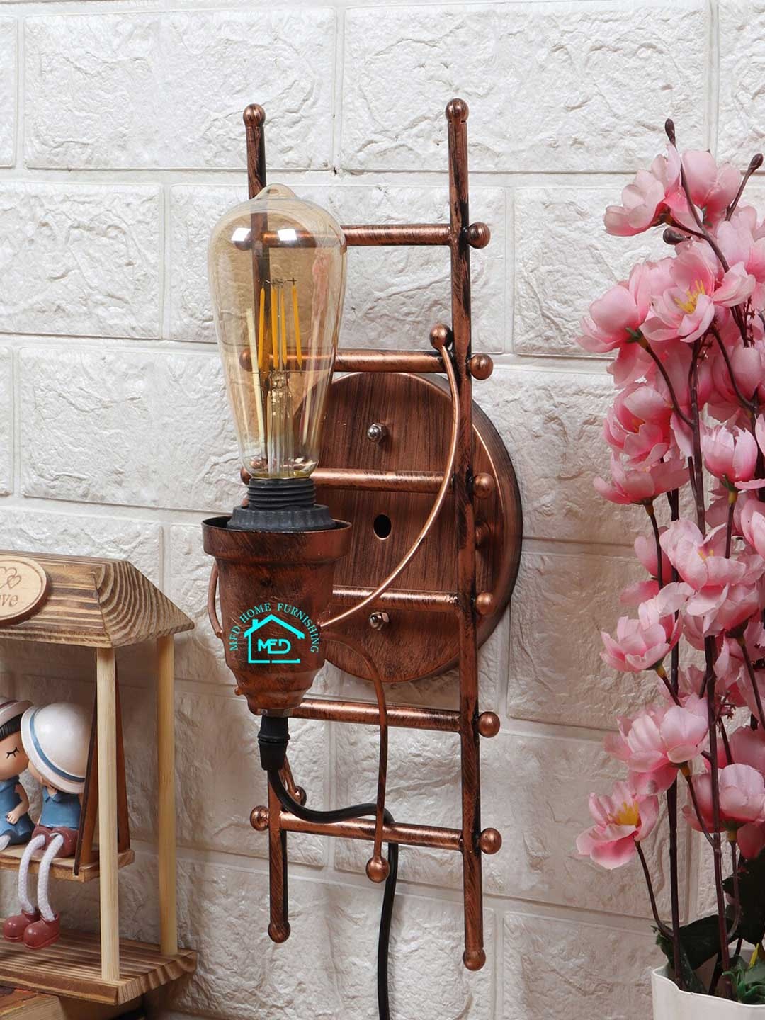 

MFD HOME FURNISHING Copper-Toned Self Design Quirky Wall Lamp