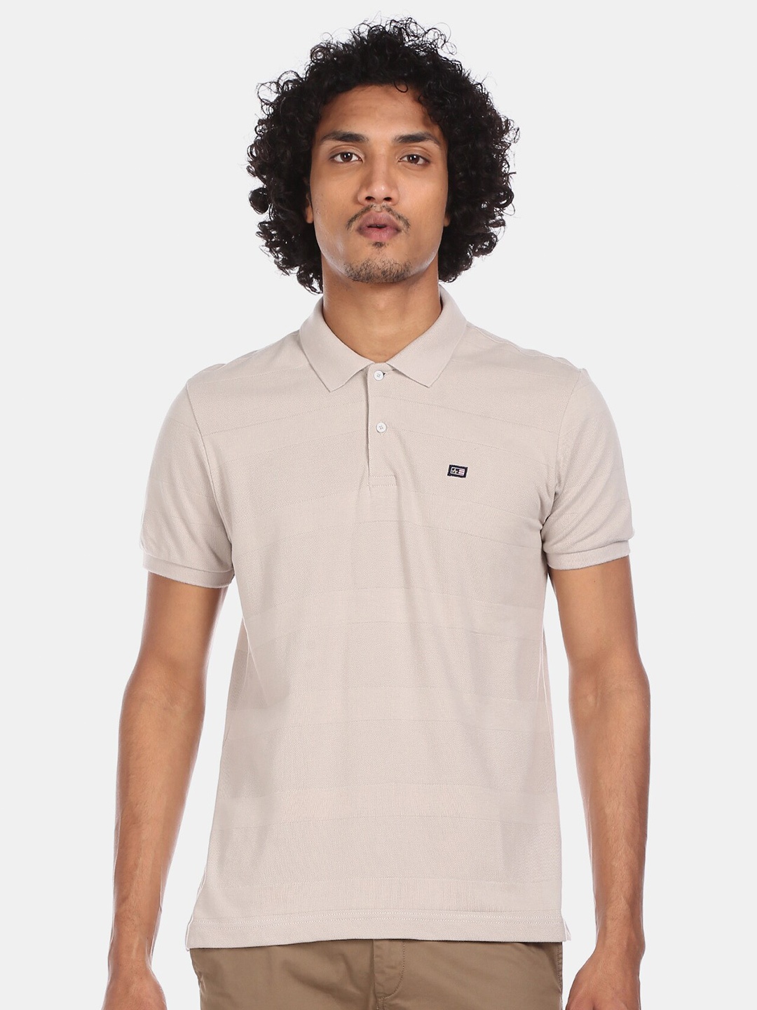 

Arrow Sport Men Beige Pure Cotton Self Striped Polo Collar T-shirt