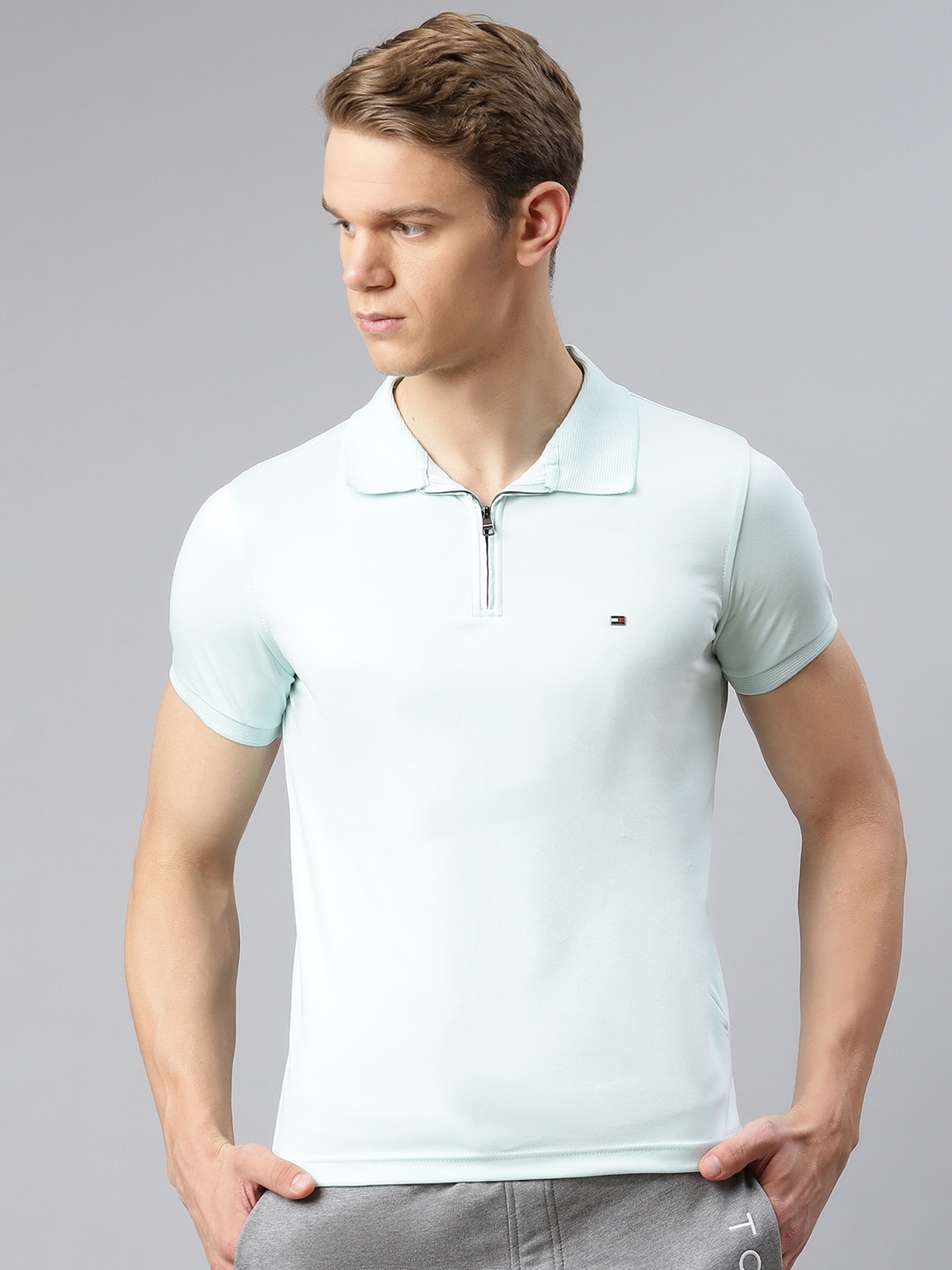 

Tommy Hilfiger Men Blue Solid Pure Cotton Polo Collar Pure Cotton T-shirt