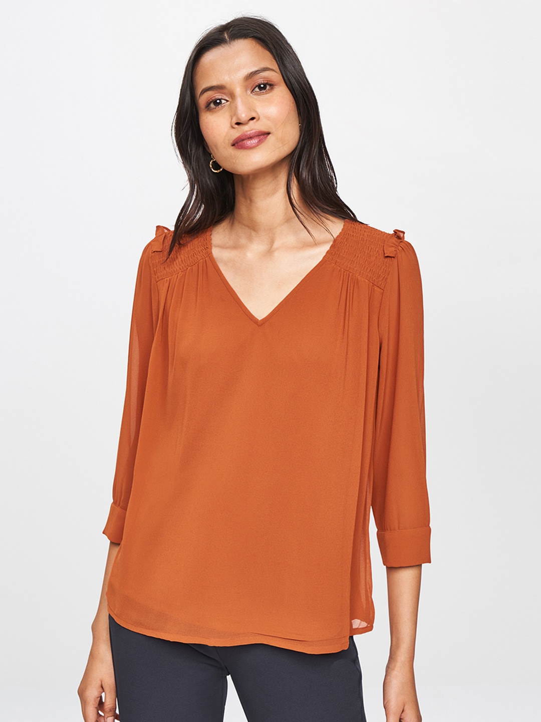 

AND Women Rust Orange Solid Top