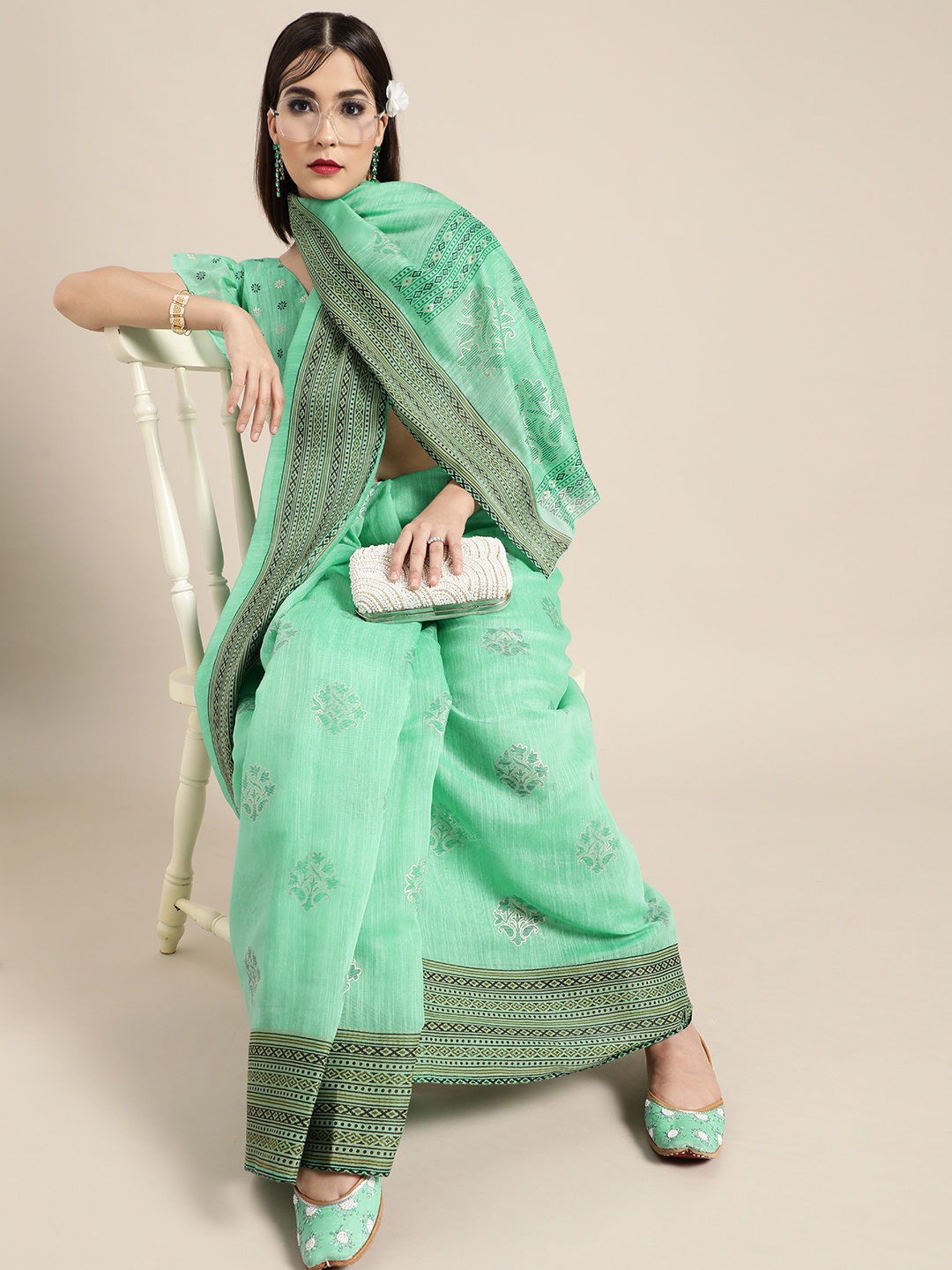 

Saree Mall Breezy Sea Green and Black Linen Blend Saree