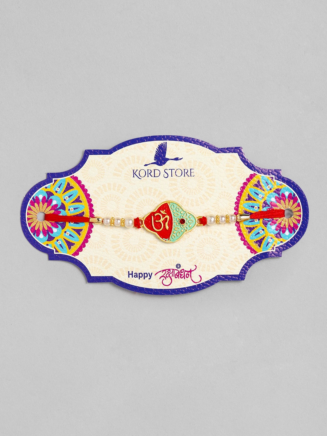 

Kord Store Red & Green Enamelled Om Thread Rakhi