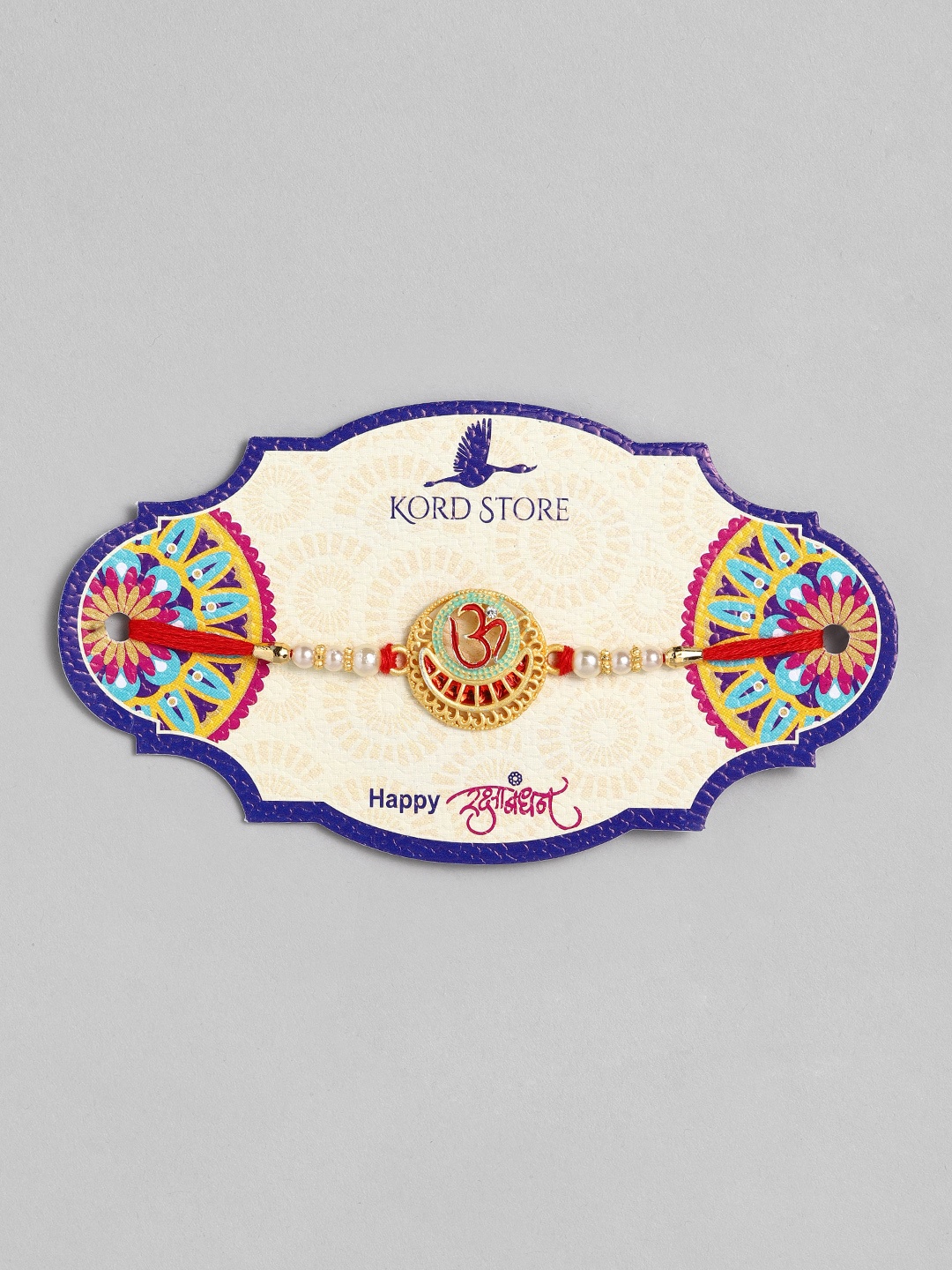 

Kord Store Red & Green Enamelled Om Ruby Stoned Thread Rakhi
