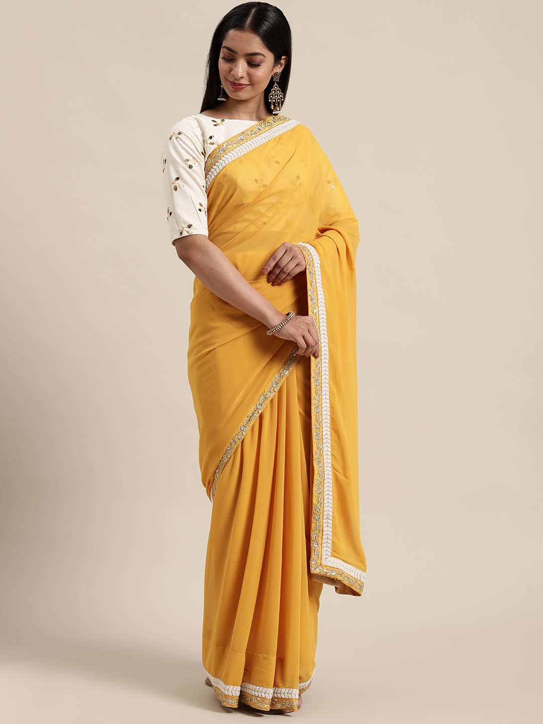 

Ethnovog Yellow Off White Beads and Stones Saree