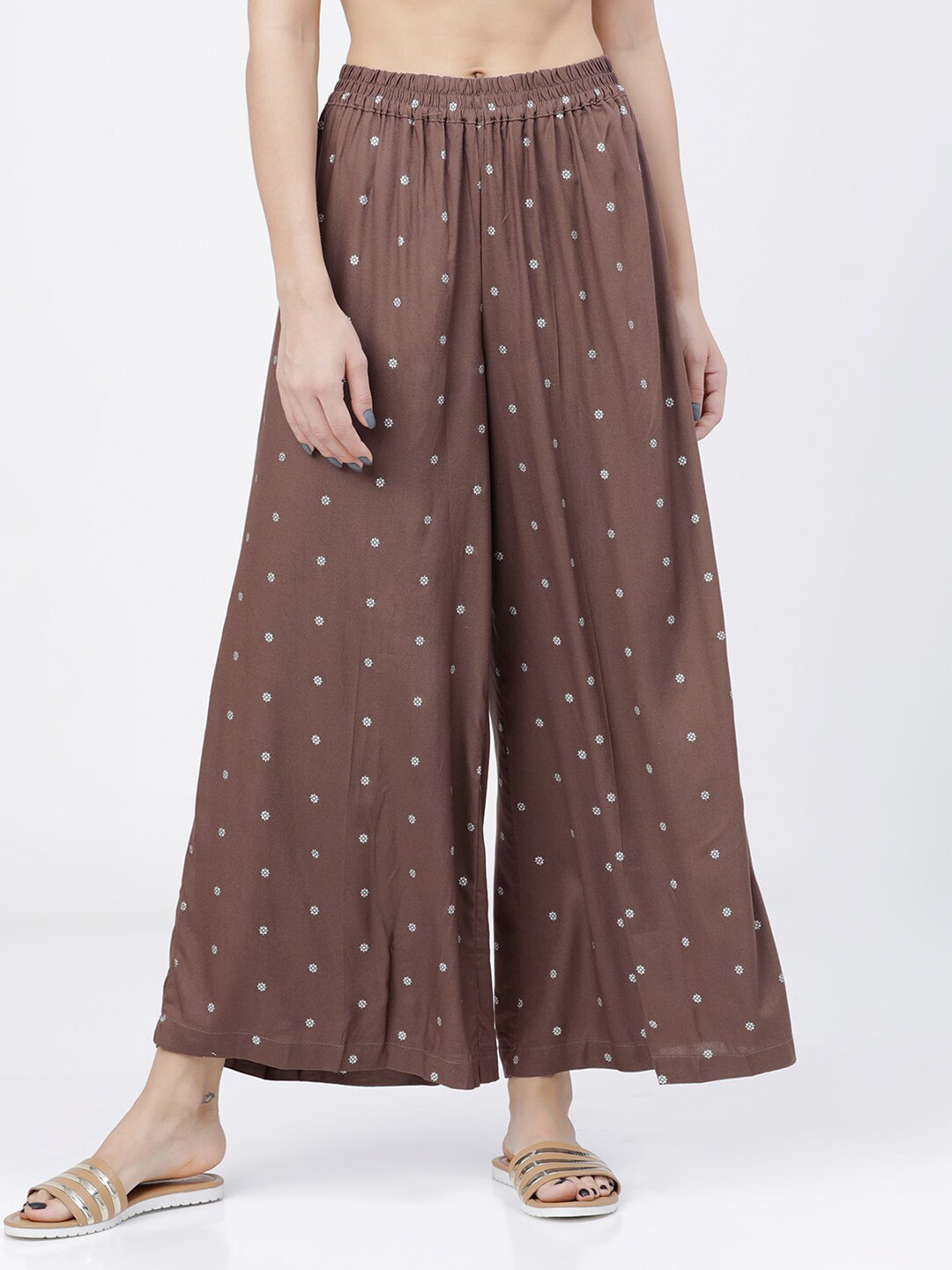 

Vishudh Women Brown & White Printed Flared Palazzos