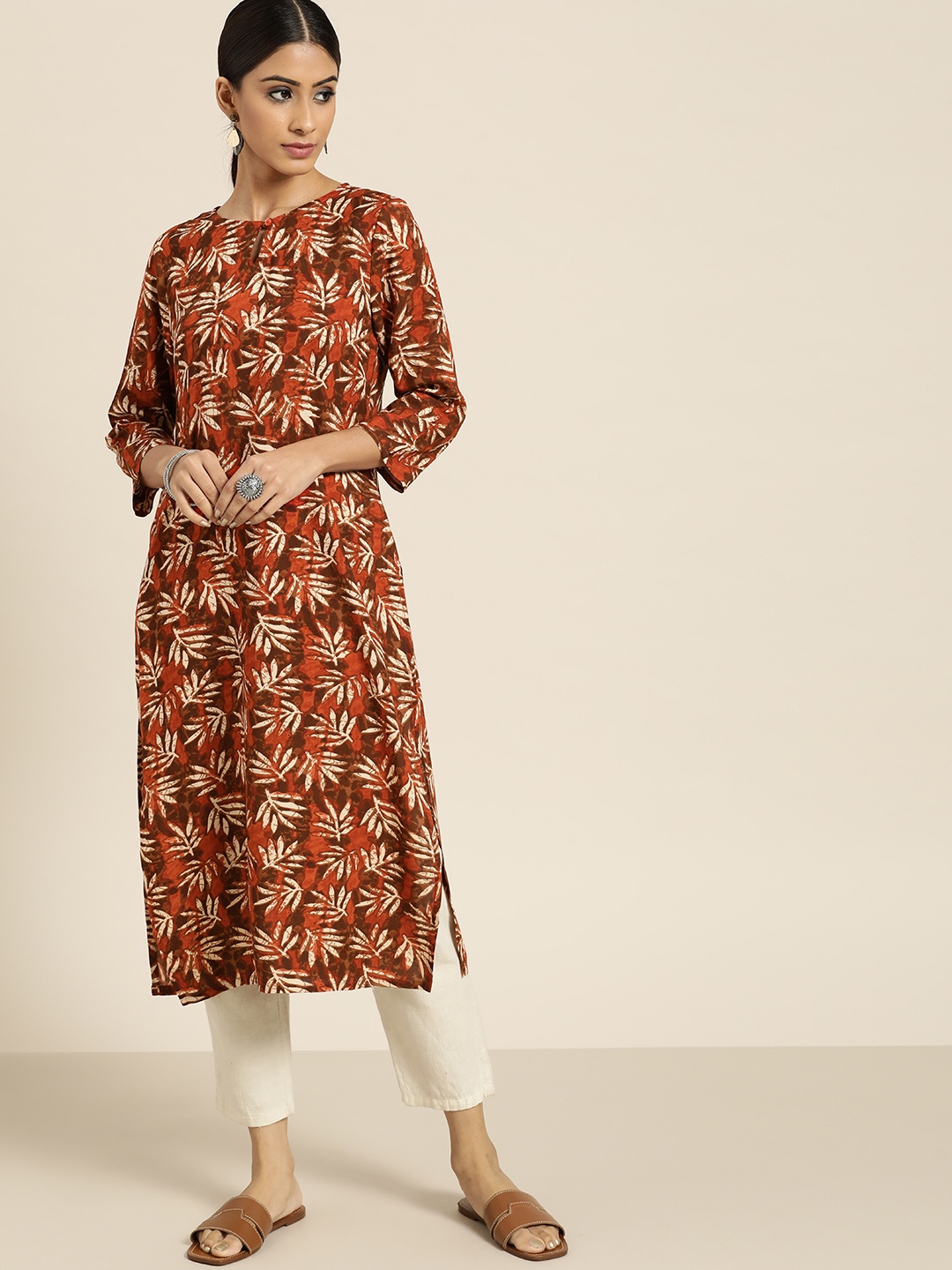 

Moda Rapido Women Rust Orange & Beige Ethnic Motifs Printed Keyhole Neck Kurta