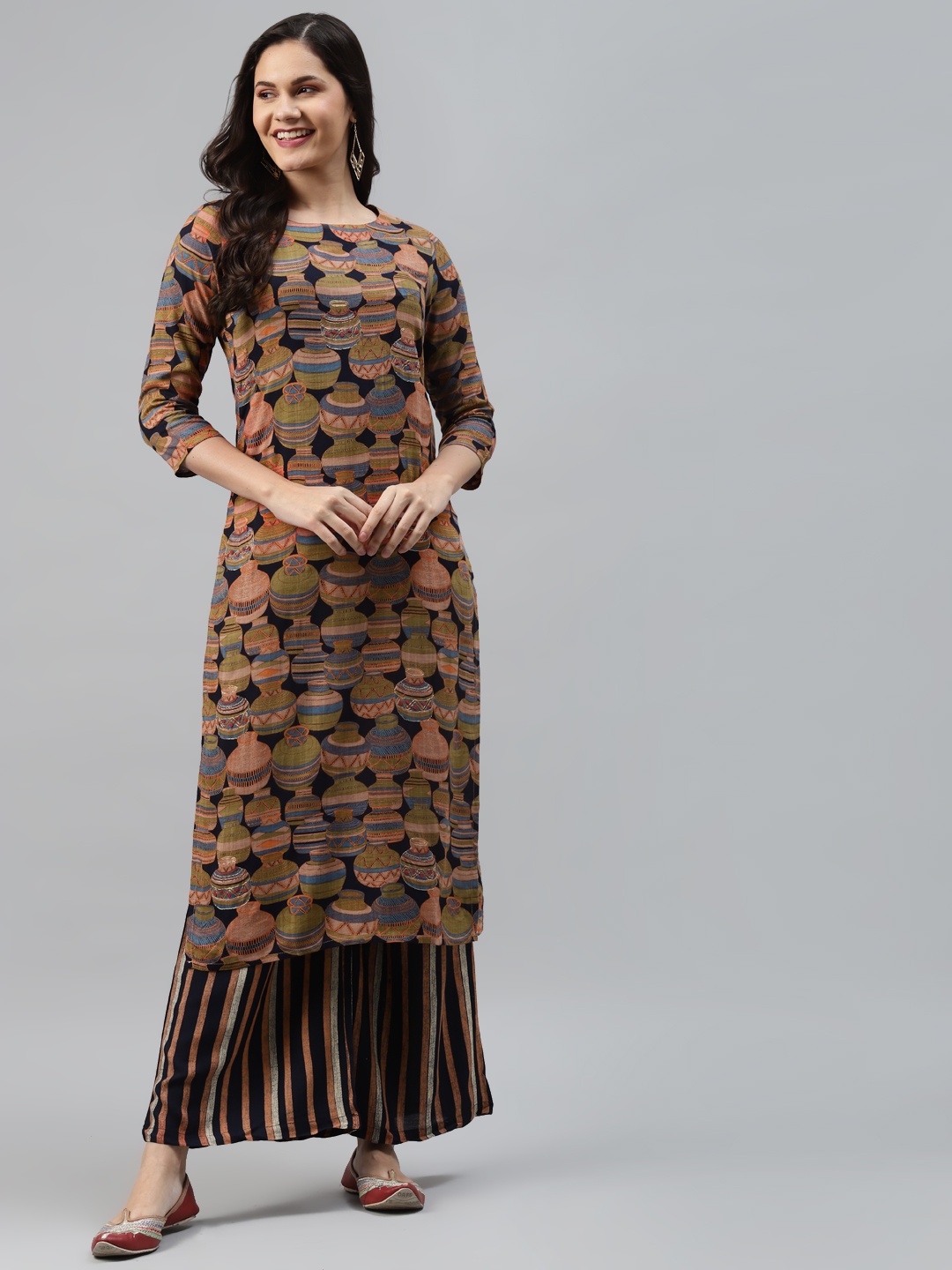 

Nehamta Women Brown & Black Ethnic Motifs Printed Regular Kurta with Palazzos