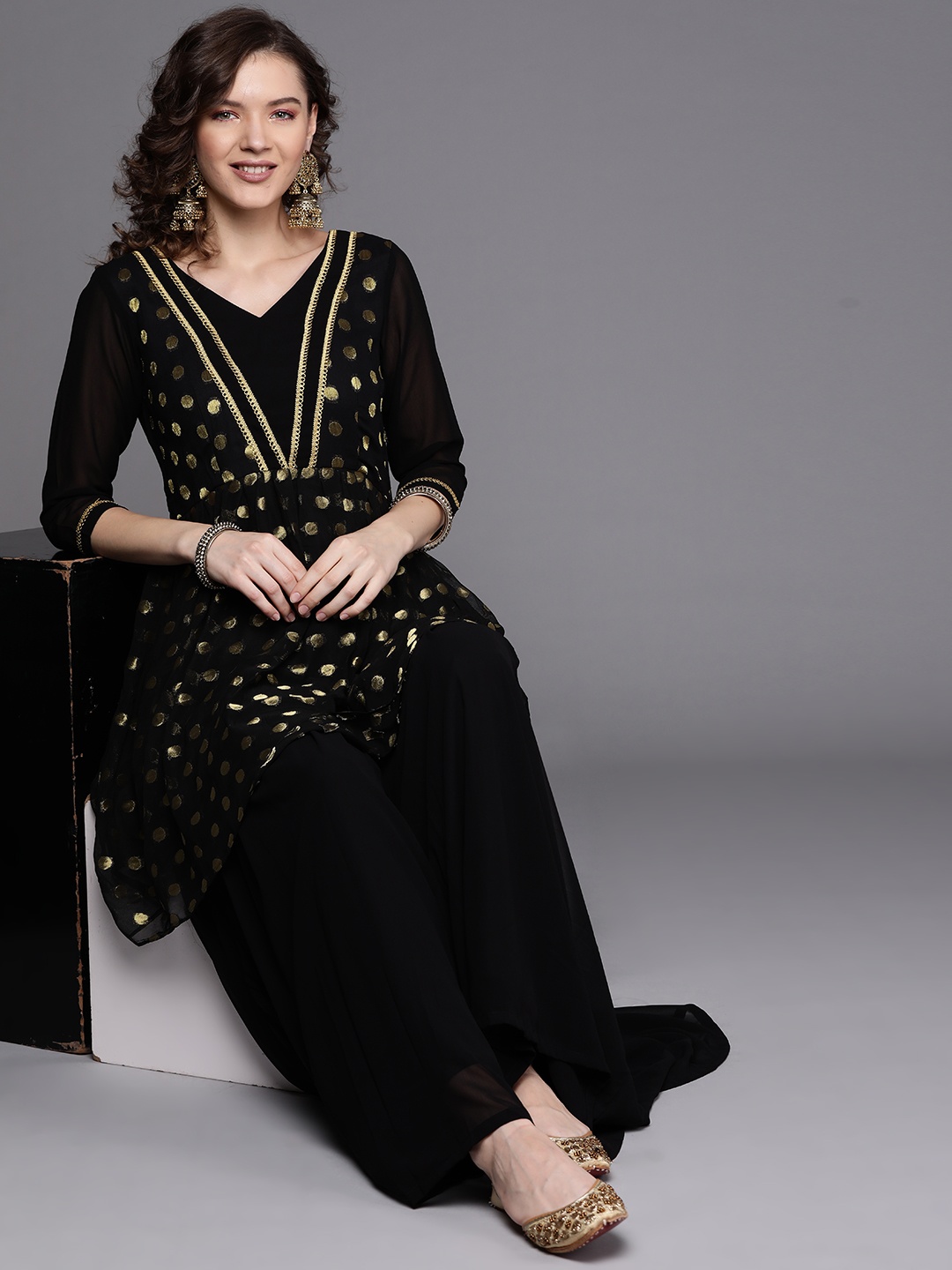

Inddus Women Black & Golden Pleated Kurta with Sharara