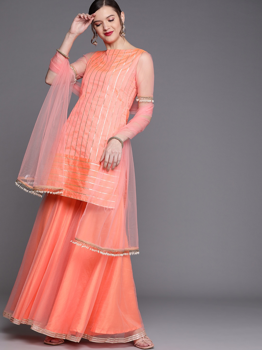 

Inddus Women Peach-Coloured & Golden Striped Gotta Patti Kurta with Sharara & Dupatta