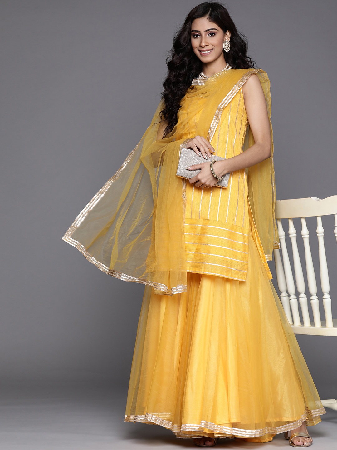 

Inddus Women Mustard Yellow & White Striped Kurta with Sharara & Dupatta