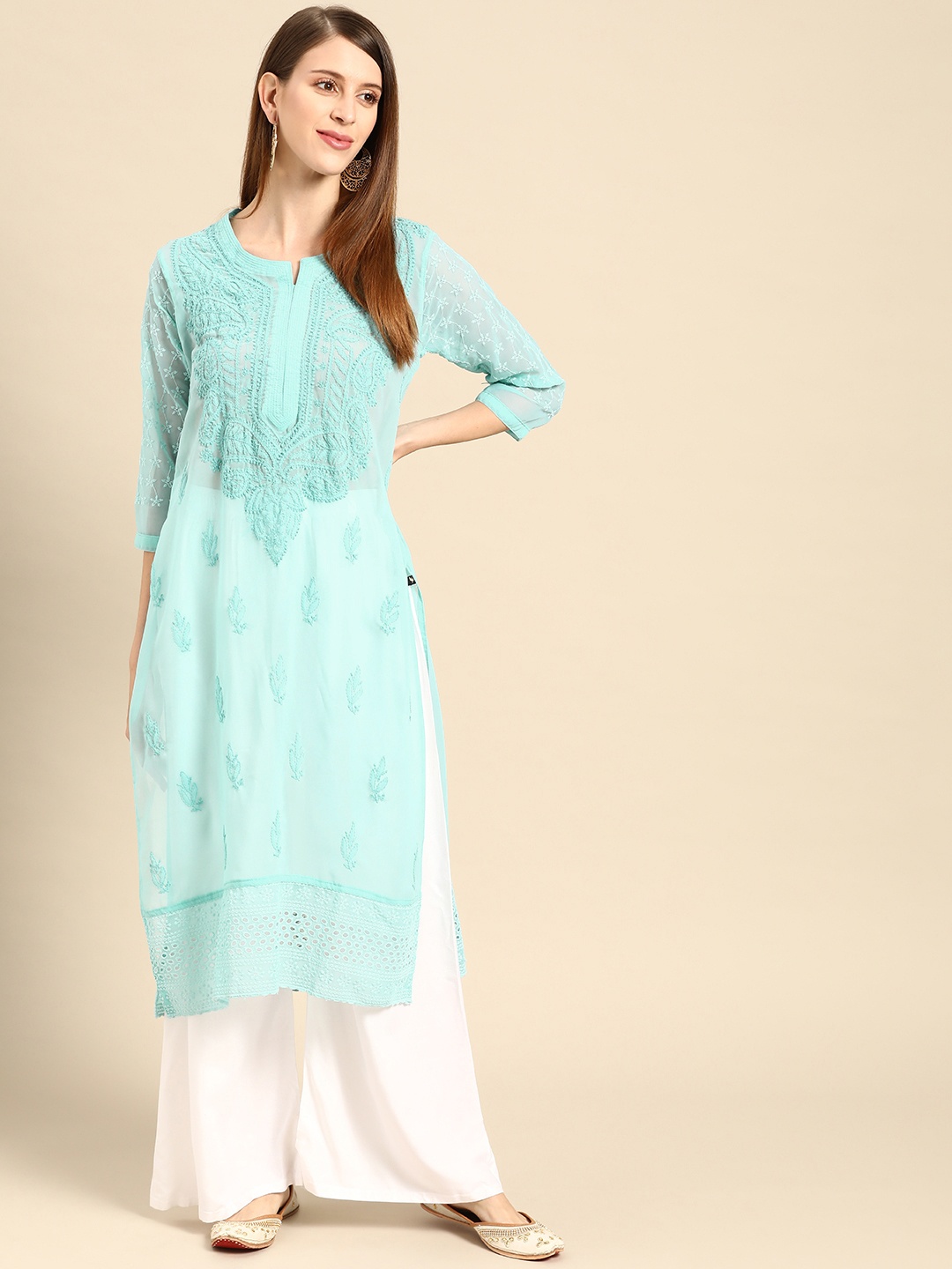 

Saadgi Women Blue & White Ethnic Motifs Embroidered Kurta with Palazzos