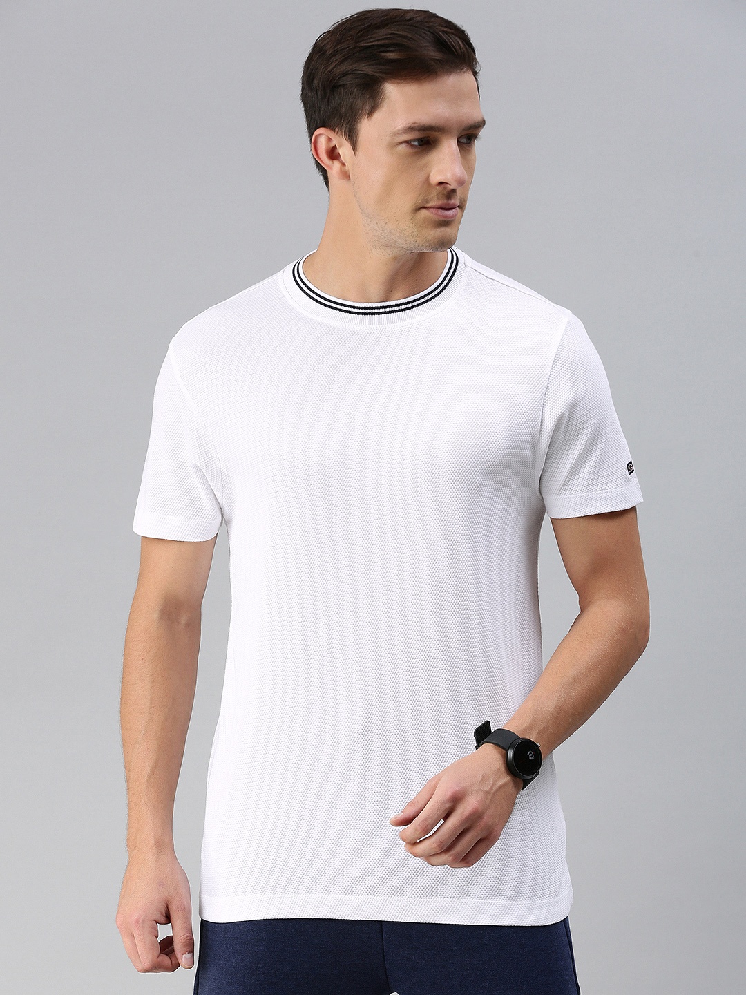 

Arrow Sport Men White Self Design Round Neck T-shirt