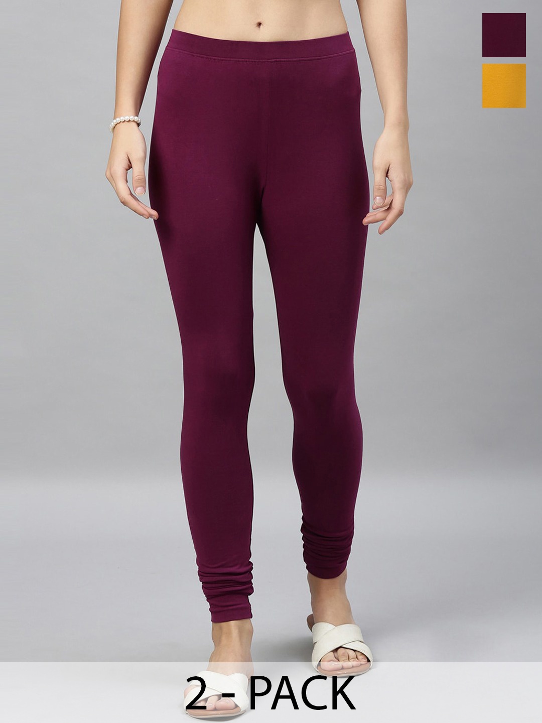 

Kryptic Women Pack of 2 Solid Churidar-Length Leggings, Mustard
