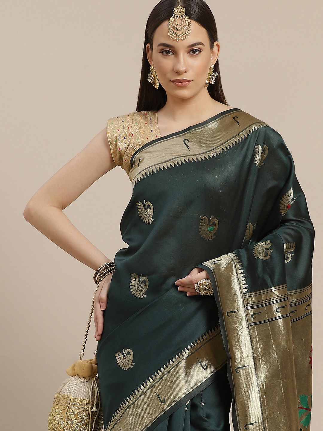 

Anouk Green & Golden Ethnic Motifs Art Silk Banarasi Saree