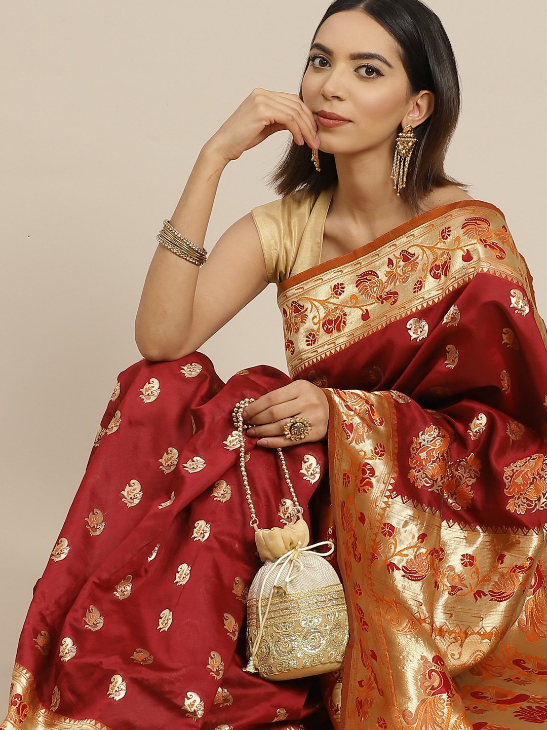 

Anouk Maroon & Golden Ethnic Motifs Banarasi Saree