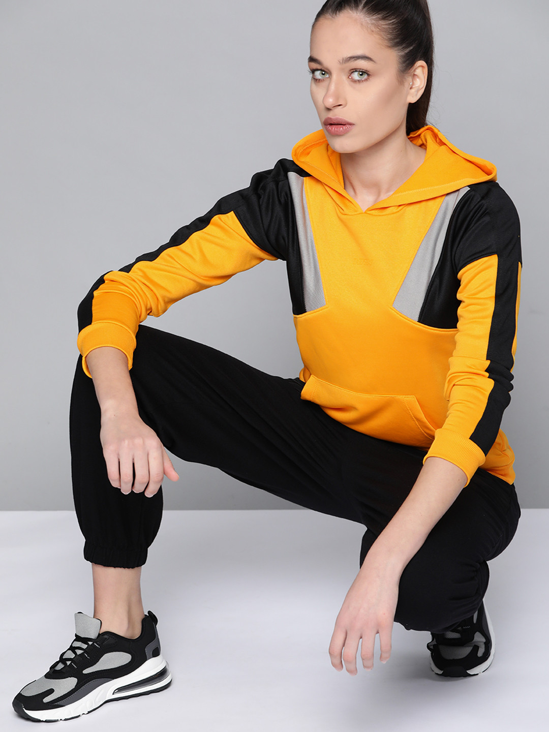 

HRX by Hrithik Roshan Women Mustard Yellow & Black Colourblocked Hooded Sweatshirt
