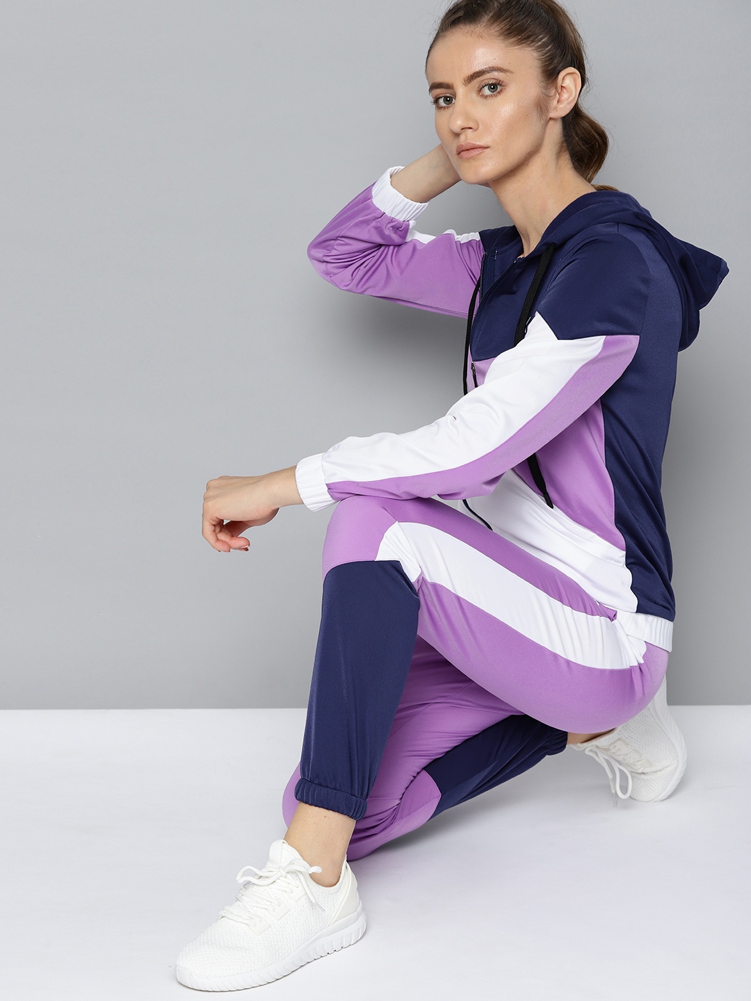 

HRX By Hrithik Roshan Lifestyle Women Magic Mauve Rapid-Dry Colourblock Tracksuits, Navy blue
