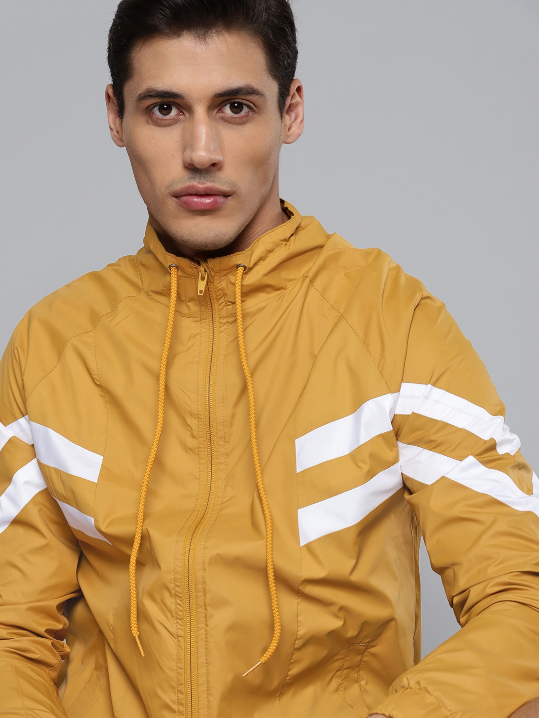

HRX by Hrithik Roshan Football Men Light Rapid-Dry Solid Sports Jacket, Mustard