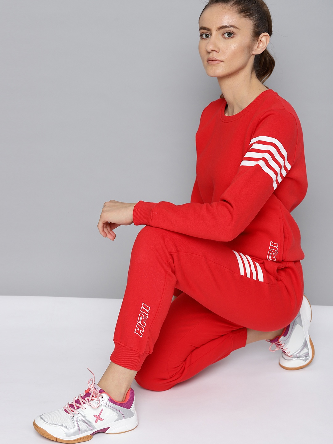 

HRX By Hrithik Roshan Lifestyle Women Red Solid Track Suit