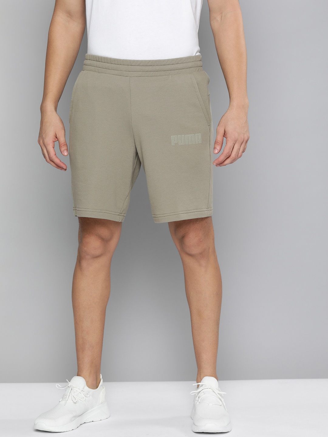

Puma Men Green Solid Mid-Rise Sports Shorts
