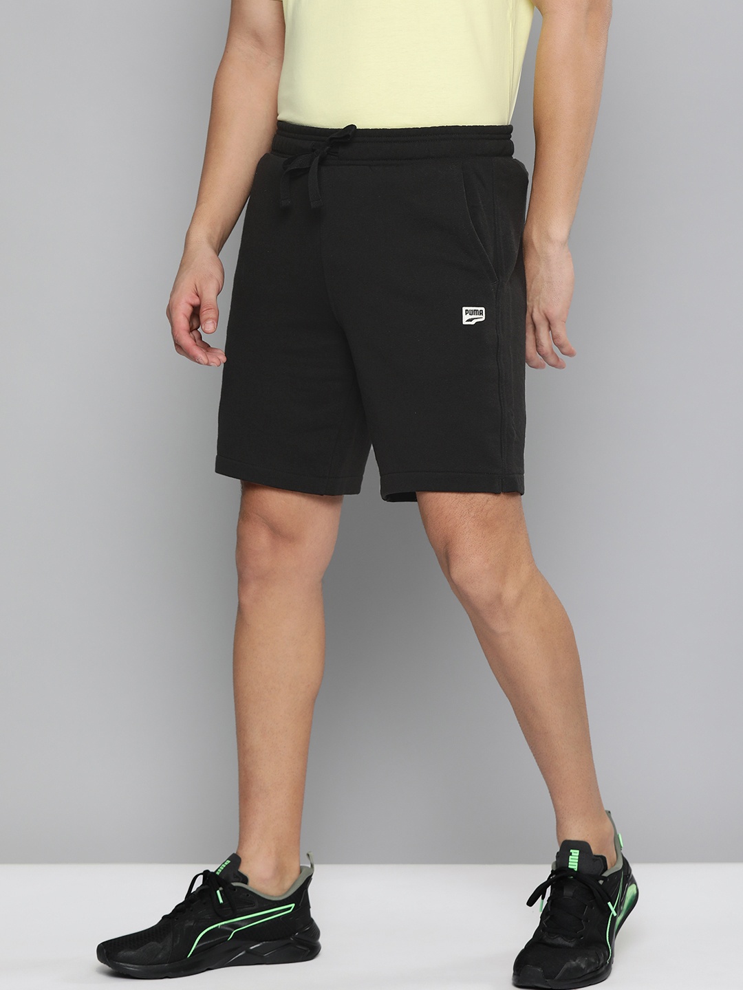 

Puma Men Black Solid Mid-Rise Sports Shorts