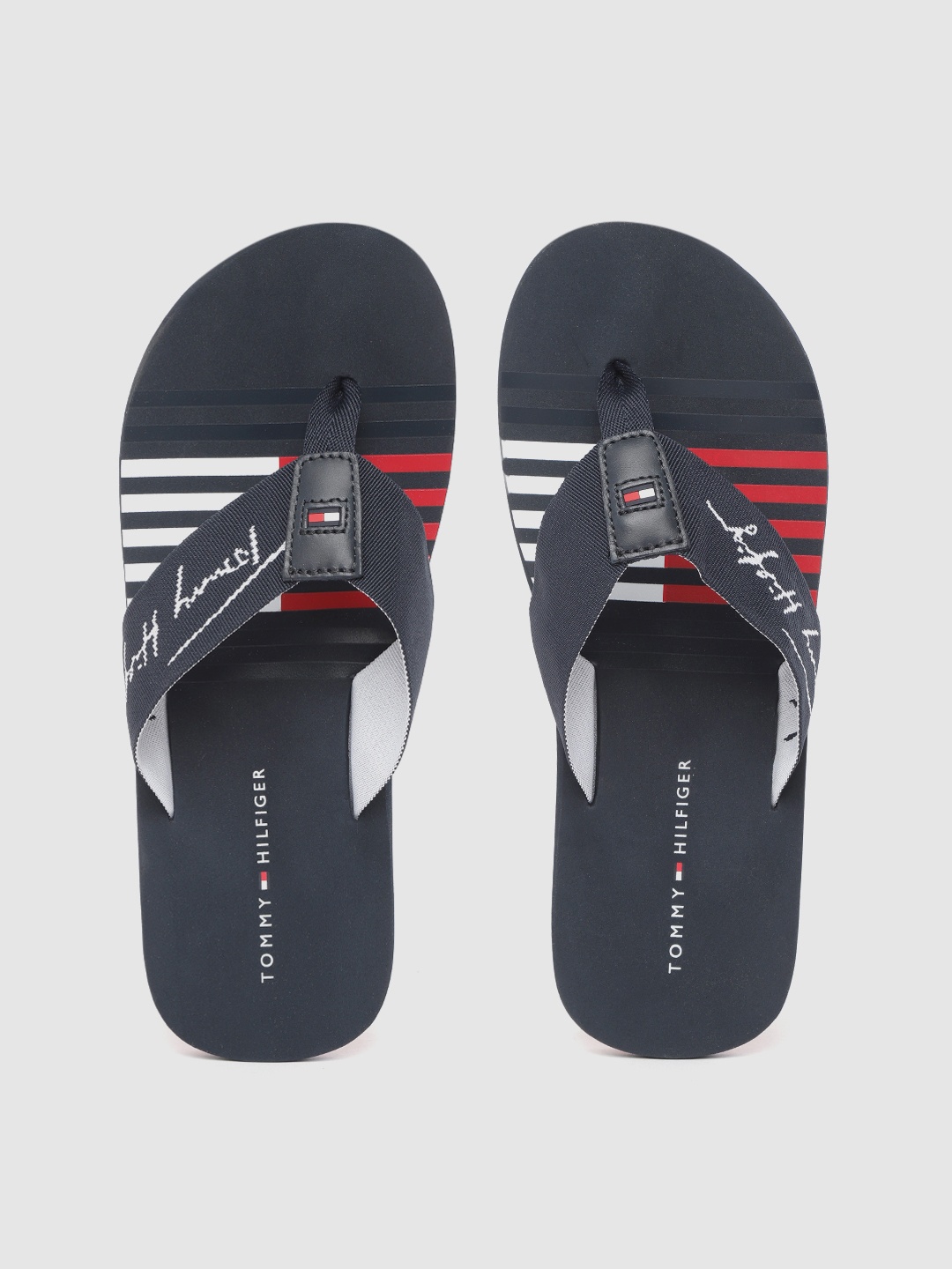 

Tommy Hilfiger Men Navy Blue & White Brand Name Patterned Thong Flip-Flops
