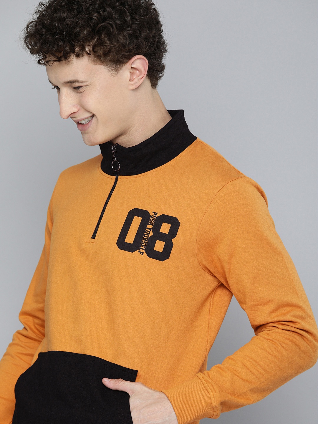 

HERE&NOW Men Orange Printed Sweatshirt