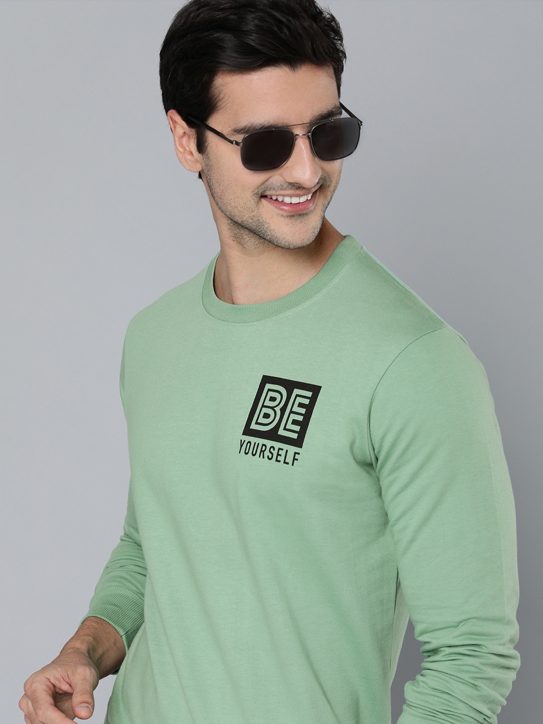 

HERE&NOW Men Green Solid Sweatshirt