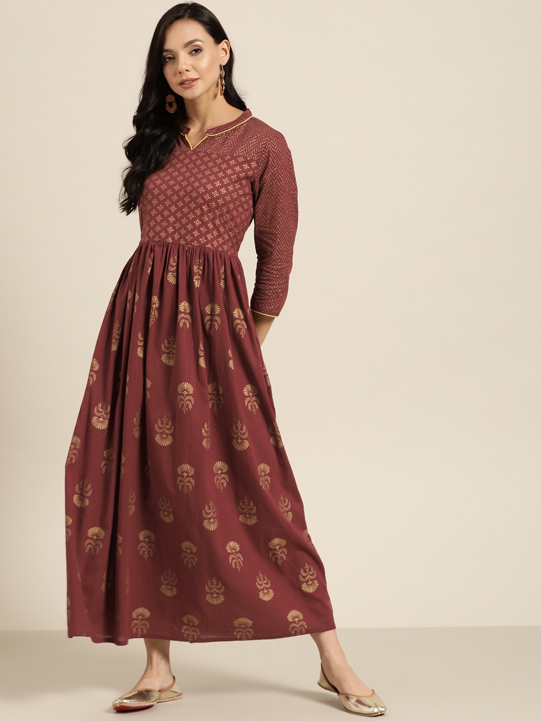 

Sangria Maroon & Golden Ethnic Motifs Cotton Maxi Dress