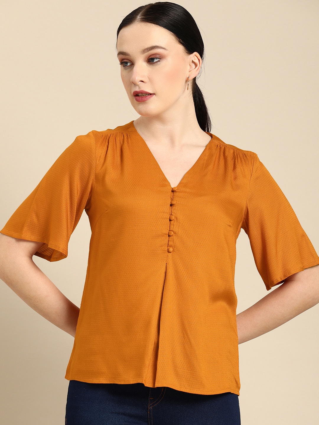 

all about you Solid Orange V-Neck Regular Top
