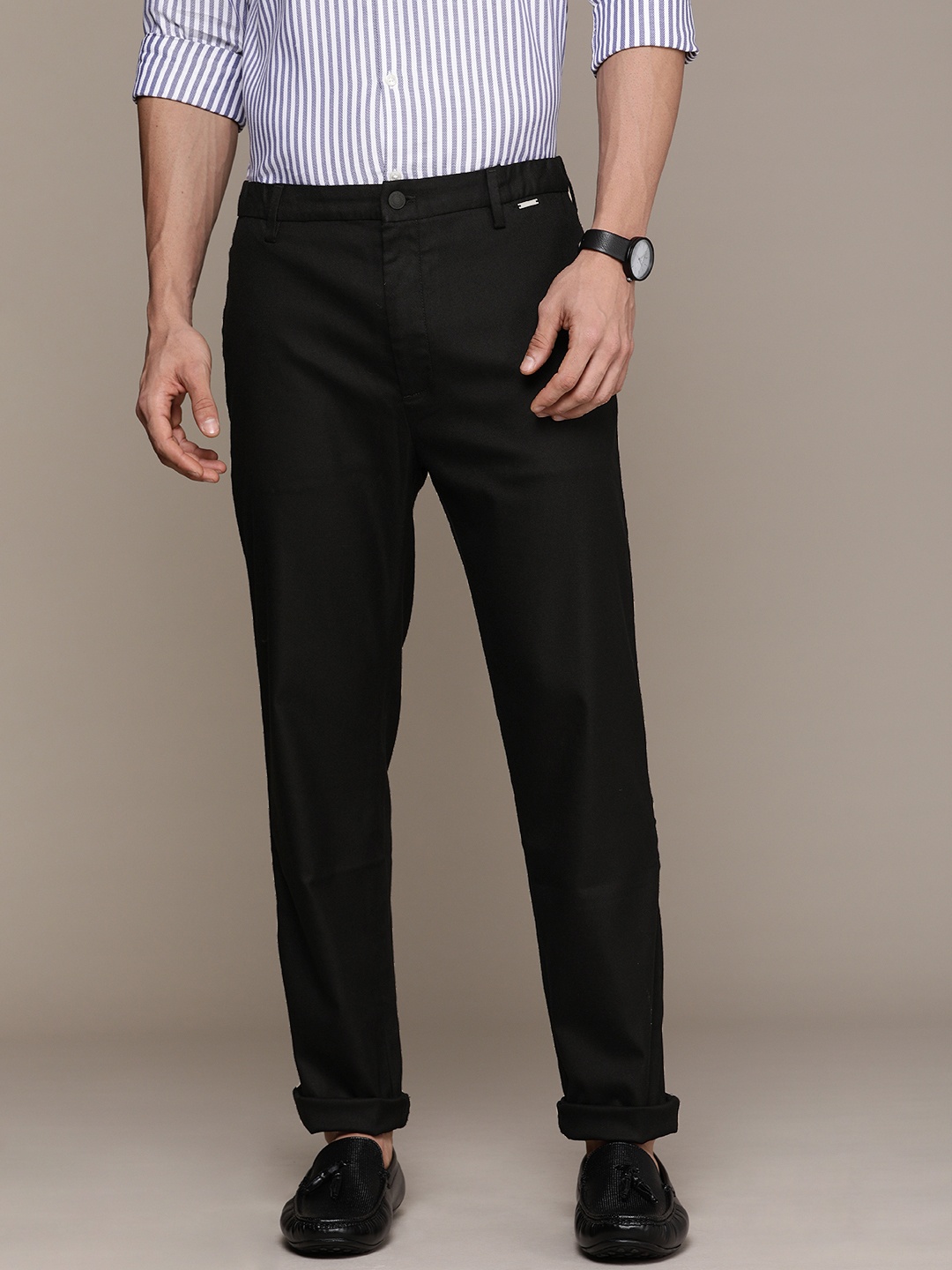 

Calvin Klein Jeans Men Black Solid Tapered Fit Trousers