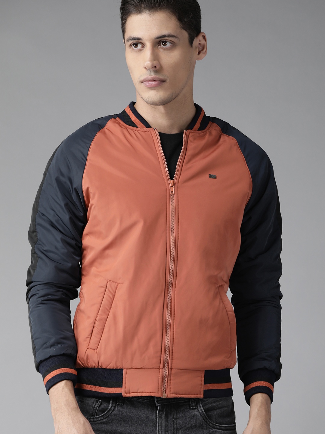 

Roadster Men Rust Orange & Navy Blue Solid Bomber Jacket