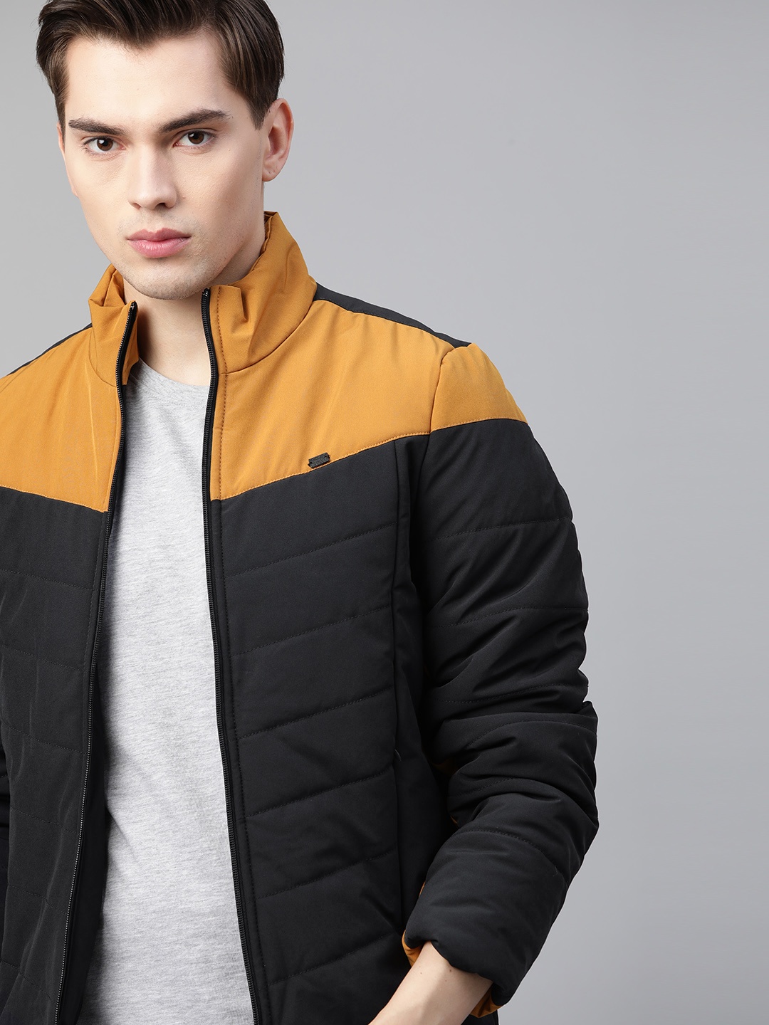 

Roadster Men Navy Blue & Mustard Yellow Colourblocked Padded Jacket