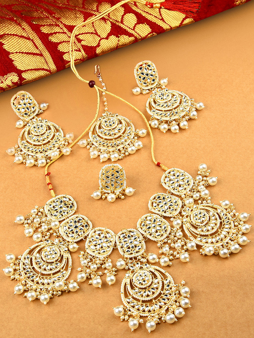 

Zaveri Pearls Off-White Gold-Plated Kundan Studded Jewellery Set